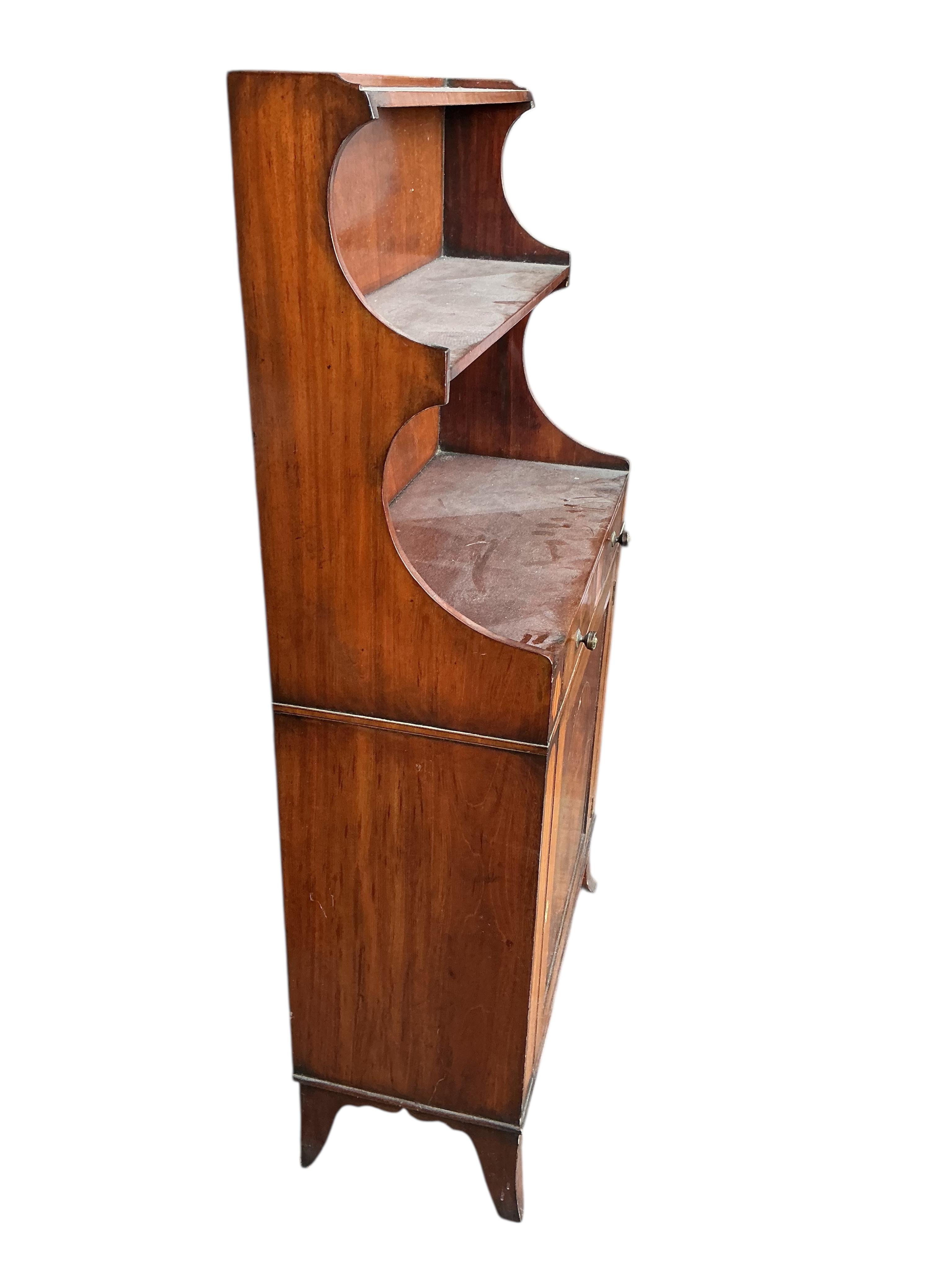 A small Regency style mahogany bookcase, width 60cm, depth 27cm, height 122cm